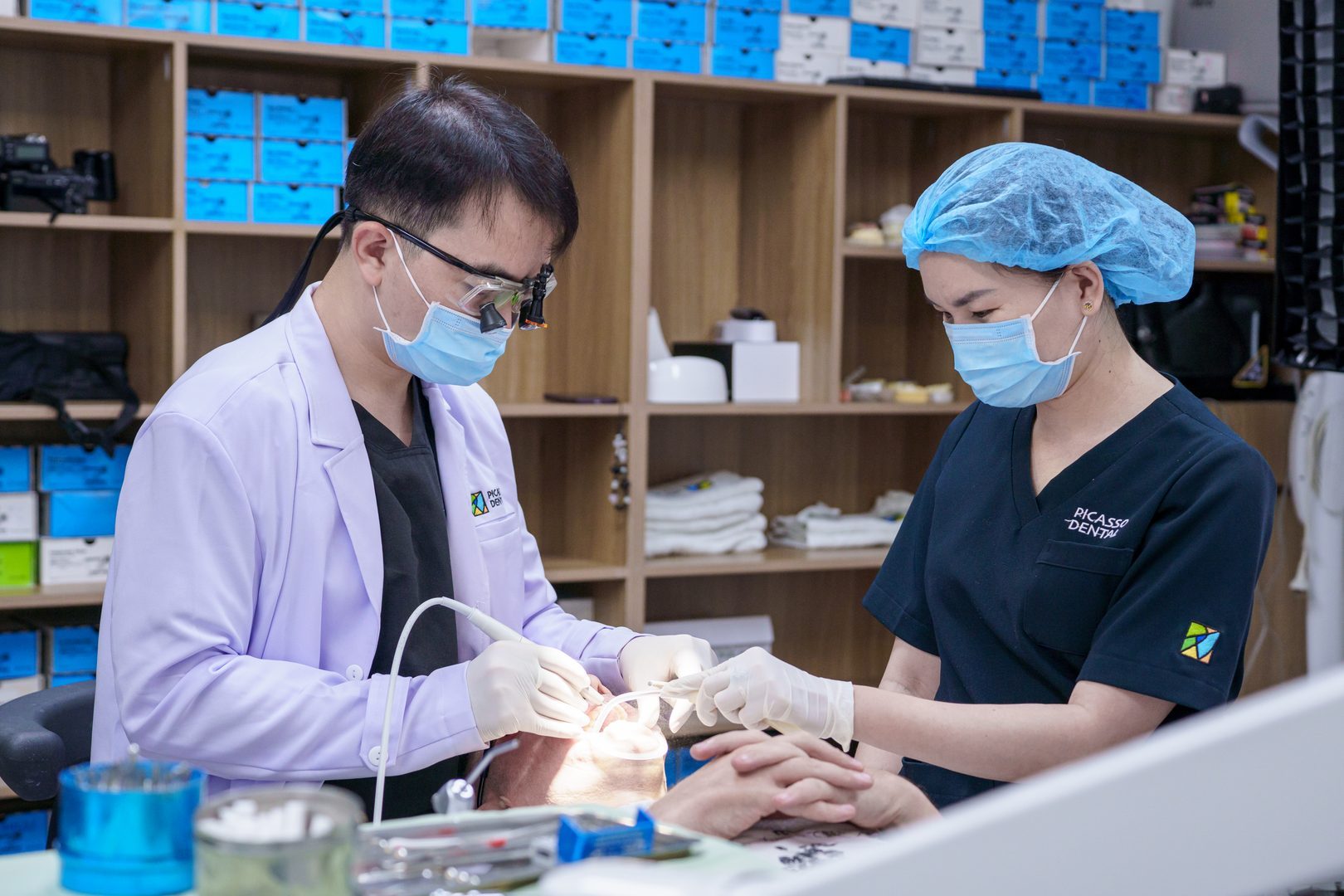 Doctor using surgical loupes during treatment at Picasso Dental Clinic - Da Nang Flagship