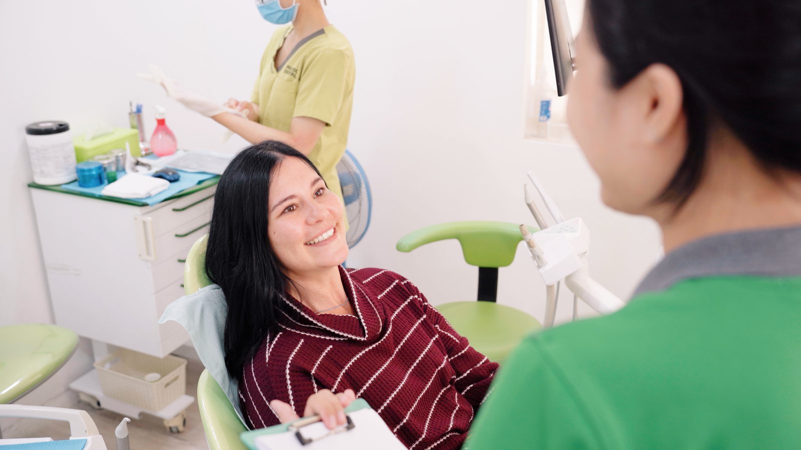 Dentist examining a patient for gum disease at Picasso Dental Clinic Ho Chi Minh City